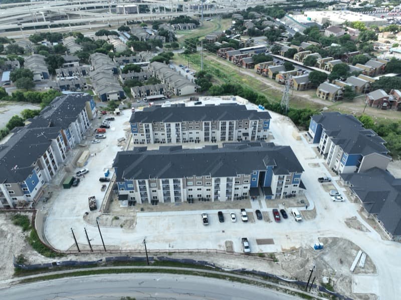 Multi-family apartment complex with concrete parking structures